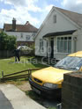 A fascia receiving the Aqua Clean treatment - note the yellow Aqua Clean van in the foreground.