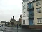 An Aqua Clean cleaner cleaning the third floor window with the pure water based telescopic pole system